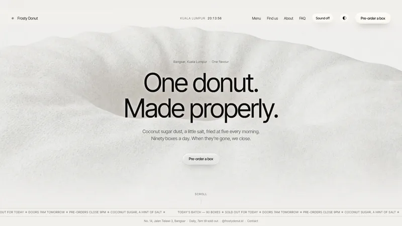 The Frosty Donut home page, showing the headline over footage of a glazed ring on a counter.